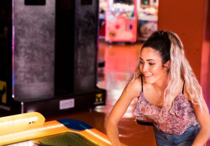 happy-woman-playing-air-hockey_23-2148253046